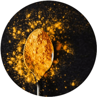 turmeric powder in a spoon