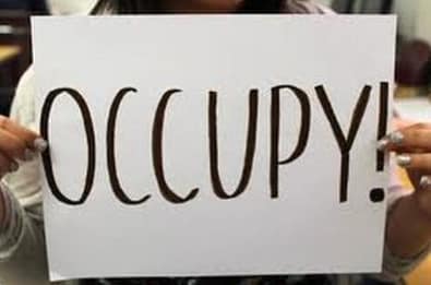 a board written on occupy