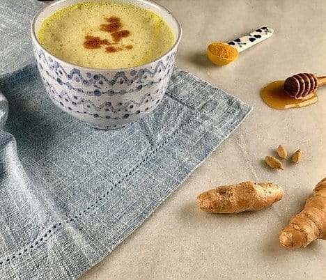 a cup with tumeric milk
