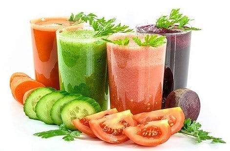 different glasses with vegetable and fruit juice