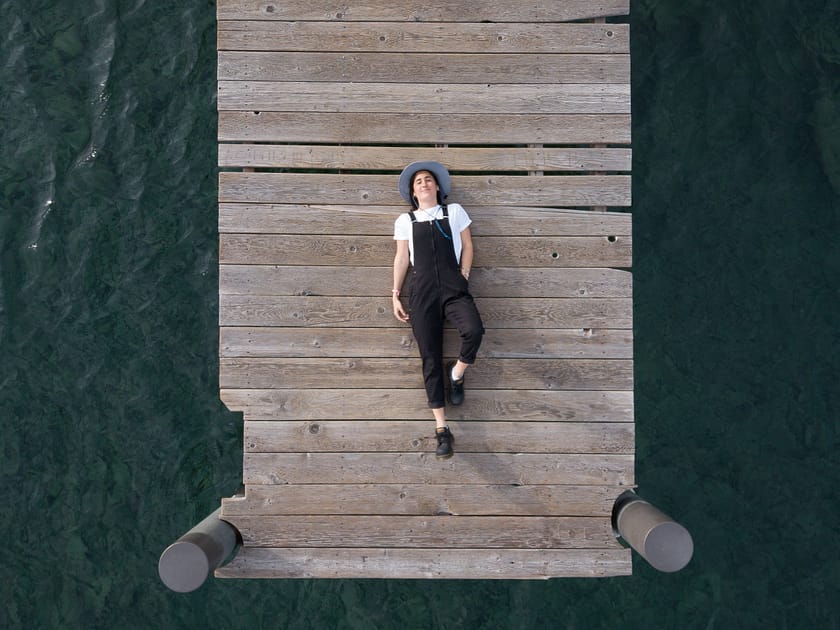 woman lying on a bridge