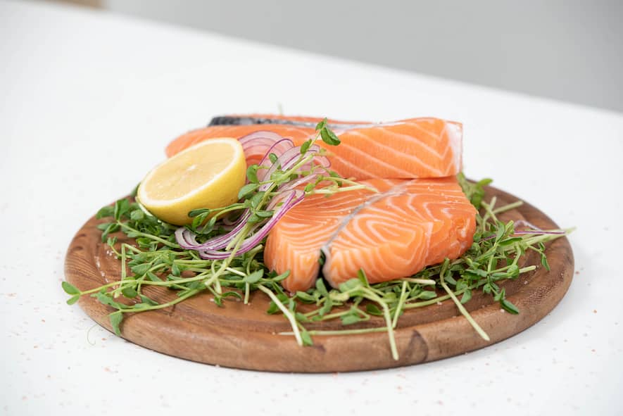 keto diet,salmon and lemon on a wooden plank
