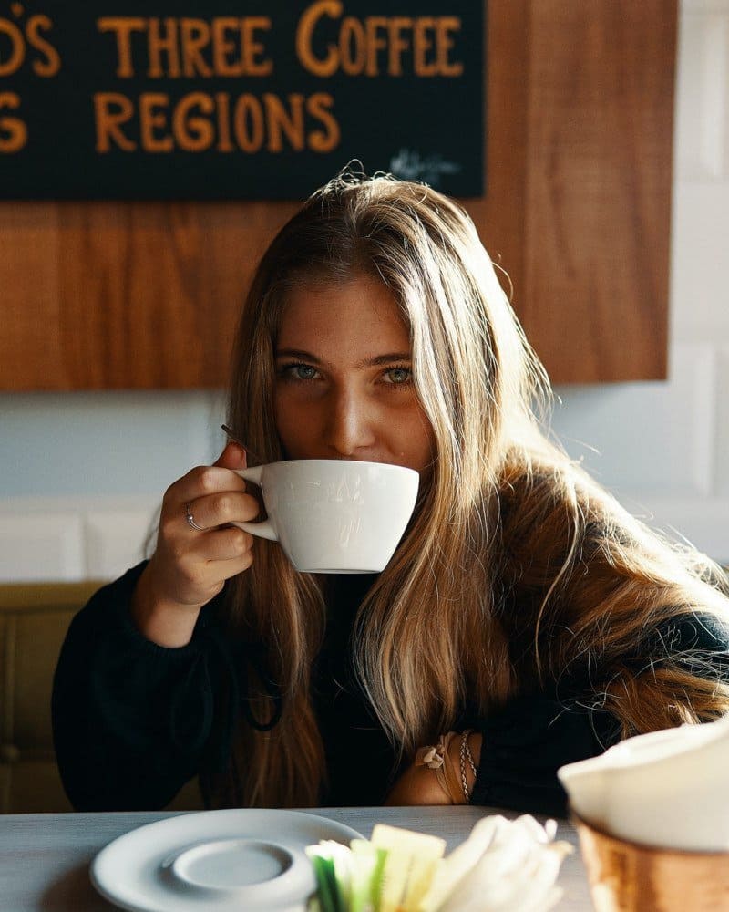 blond woman drinking coffee